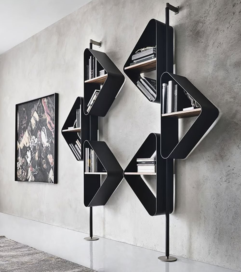 Spinnaker Bookshelf – a sculptural curved bookshelf inspired by the shape of a sail, blending elegance with dynamic movement.